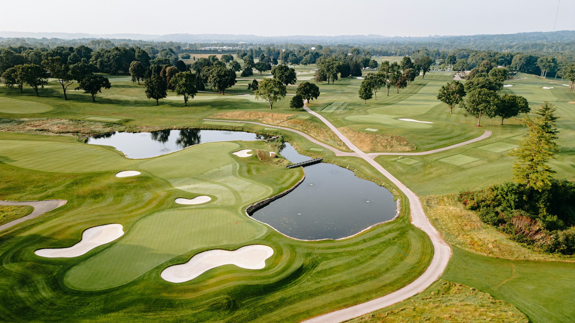 Aerial view of a championship golf course with lakes