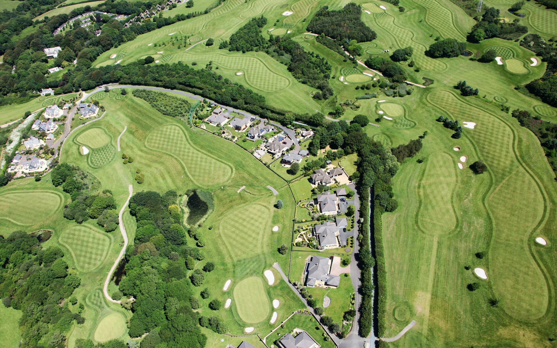 Aerial view of villas around a golf course